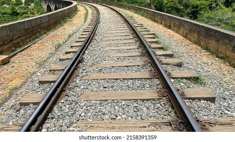 Ella, Sri Lanka – April 15, 2022: Train tracks on the Nine Arches Bridge, a famous tourist spot in Sri Lanka. 