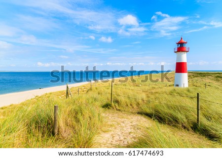 Ellenbogen lighthouse on sand dune and beach view on northern coast of Sylt island, Germany