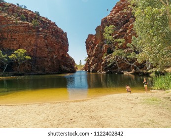 Ellery Creek Big Hole, West Mac Donnell Rangers NP, Alice Springs,  Central Australia. September 2017.  Tourist At A Waterhole With Man Taking A Photo.