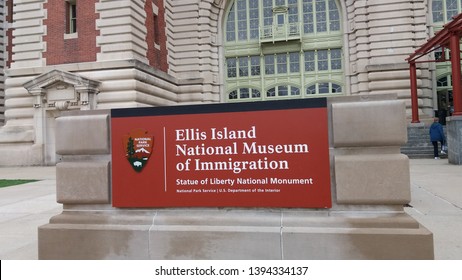 Ellis Island, New Jersey, USA. May 2nd, 2017 — A signboard stating Ellis Island National Museum of Immigration in front of a building. The museum is a part of Statue of Liberty National Monument. 