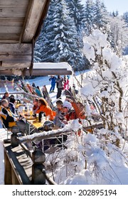 ELLMAU, AUSTRIA - JANUARY 29, 2014 : Unknown Skiers Are Sitting At Slope Bar For Apres Ski In Ellmau, Austria On January 29, 2014.