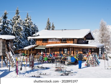 ELLMAU, AUSTRIA - JANUARY 29, 2014 : Unknown Skiers Are Sitting At Wood Chalet Bar For Apres Ski In Ellmau, Austria On January 29, 2014.