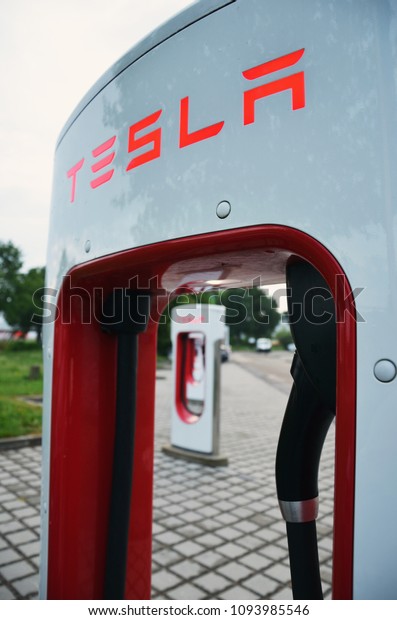 Ellwangen, Germany - May 15, 2018: Tesla\
Supercharger Station with Tesla Logo in Ellwangen.\
