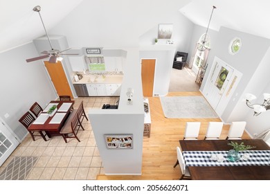 ELMHURST, IL, USA - MAY 4, 2021: An Overhead View Of A Suburban Homes White Kitchen, Dining Room, Foyer, And Living Room.