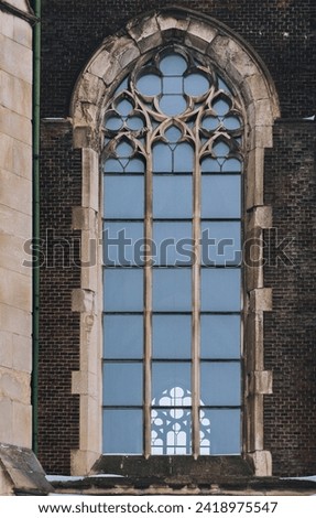 Elongated vintage vertical window on the facade of the building. Baroque and Gothic architecture. Church of St. Olga and Elizabeth. Lviv, Ukraine. Stock photo © 