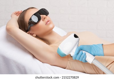 Elos epilation hair removal procedure on a woman’s body. Beautician doing laser rejuvenation in a beauty salon. Removing unwanted body hair. Hardware ipl cosmetology - Shutterstock ID 2152270829