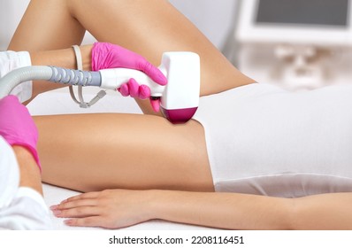 Elos epilation, hair removal procedure on a woman’s body. Beautician doing laser rejuvenation in a beauty salon. Removing unwanted body hair. Hardware ipl cosmetology