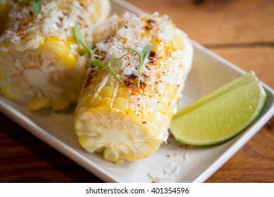 Elote or Mexican grilled corn on the cob served with cotija cheese and chili powder.