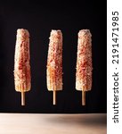 Elotes Callejeros are a popular street snack in Mexico, it is tender corn cooked with spices, skewered on a wooden stick covered with mayonnaise or sour cream, fresh cheese and piquin chili powder.