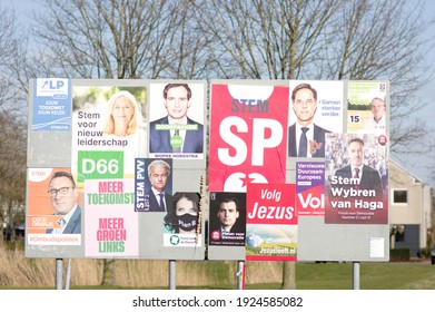 Elst, Netherlands - February 24, 2021: Billboard with dutch political campaign posters for the Dutch House of Representatives elections in march 2021.