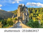  Eltz Castle is a medieval castle nestled in the hills above the Moselle between Koblenz and Trier, Germany. It is still owned by a branch of House of Eltz who have lived there since the 12th century.