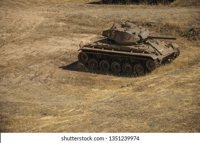 Elvas, Portugal - July 07, 2018. Outdated War Tank Next To The Wall That Encircle The City Of Elvas. A Gracious Star-shaped Fortress City On The Easternmost Frontier Of Portugal.