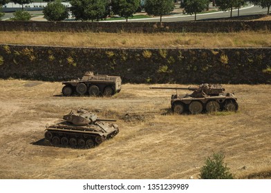 Elvas, Portugal - July 07, 2018. Outdated War Tanks Next To The Wall That Encircle The City Of Elvas. A Gracious Star-shaped Fortress City On The Easternmost Frontier Of Portugal.