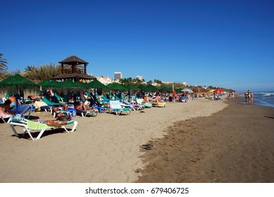 ELVIRIA, SPAIN - SEPTEMBER 12, 2008 - Tourists Relaxing On Playa De La Vibora Beach, Elviria, Marbella, Malaga Province, Andalusia, Spain, Western Europe, September 12, 2008.