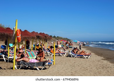 ELVIRIA, SPAIN - SEPTEMBER 12, 2008 - Tourists Relaxing On Playa De La Vibora Beach, Elviria, Marbella, Malaga Province, Andalusia, Spain, Western Europe, September 12, 2008.