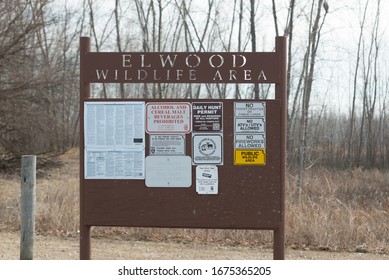 Elwood, Kansas / United States Of America - February 17th, 2020 : Elwood Wildlife Area Entrance Sign, With Postings About Hunting And Fishing Licensing, And Park Regulations, With Park In Background.