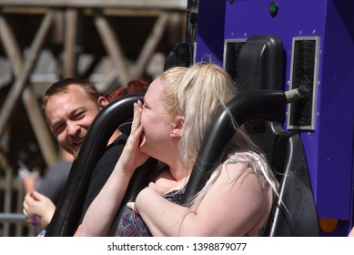 Elysburg, PA/USA-May 10, 2019:  A Young Attractive Couple Shares Nervous Laughter After A Scary Daring Amusement Ride At Knoebel's Amusement Park.