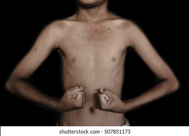 emaciated naked body on black background with black shadow