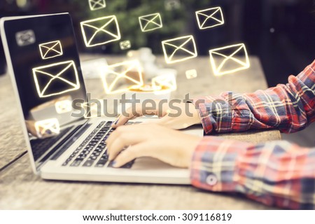 Email concept with laptop ang girl hands