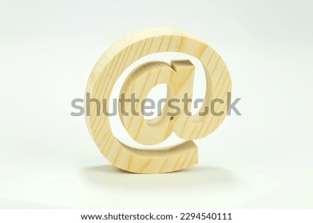 The email is made of a wooden pine symbol on white background, contact us and e-mail address.