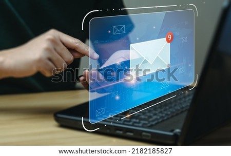 email marketing concept. Businessman using mobile phone or notebook to check email. electronic mail, e-commerce. newsletter email and protect your personal information from spam mail concept