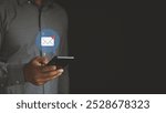 Email marketing concept. Hand of a businessman using a smartphone for an email with notification alert, an Online communication concept. company sending many e-mails or digital newsletter to customer