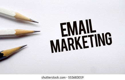 Email Marketing  Memo Written On A White Background With Pencils