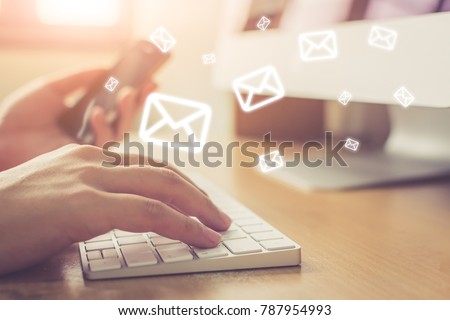 Email marketing and newsletter concept, Hand of man sending message and mobile phone with email icon