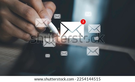 Email notification alert, E-mail marketing concept Businessman using tablet with  mail message on virtual screen sending or reply online communication  social advertisement contact.