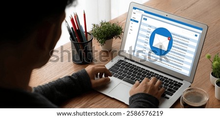 Email notification message showing on computer screen snugly. Digital marketing message information text from business to customer client