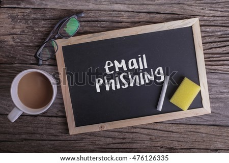 Email phising On blackboard with cup of coffee, with glasses on wooden background