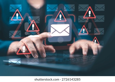 Email security software detecting phishing or scam emails with warning alerts, as a businessperson touches the email icon to delete malicious messages and protect sensitive data.
