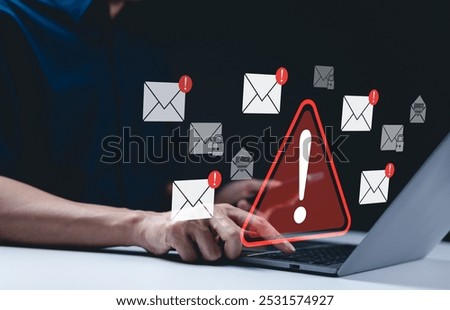 Email security warning notification concept. A person using laptop with email security alert icons and warning notifications, indicating cybersecurity threats such as spam, viruses, junk mail, scams,