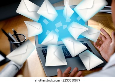 Email spam. Man with laptop and many letters, closeup - Shutterstock ID 2233330879