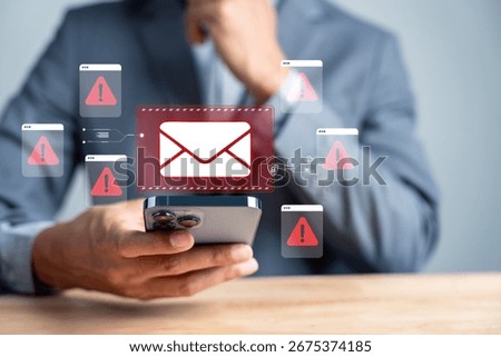 Email warning danger. Man checking smartphone with red alert email. phishing scams, email threats, cybersecurity risk, and online fraud prevention.