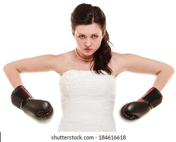 Emancipation. Bride in wedding dress wearing boxing gloves. Woman showing her power domination isolated.