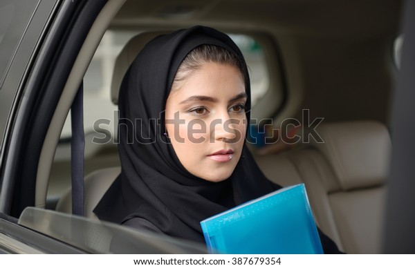 Emarati Arab Business woman in the car in\
Dubai, United Arab\
Emirates.