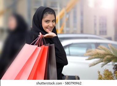 Emarati Arab women coming out of shopping in Dubai, United Arab Emirates.