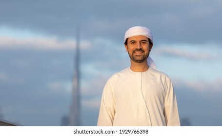 Emarati Man During Sunrise At Al Jaddaf Walk In Dubai With Burj Khalifa At The Background