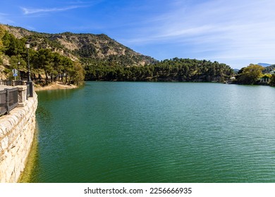 Embalse del Conde de Guadalhorce reservoir, manmade lake in a nature park with panoramic mountains and forest. Parque Natural de Ardales, Malaga province, Andalusia, Spain.