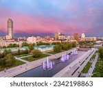 Embankment of the central pond and musical fountain. The historic center of the city of Yekaterinburg, Russia, Sunset in the summer or spring. Aerial View