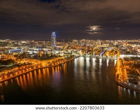 Embankment of central pond and Plotinka in Yekaterinburg at summer or early autumn night. Night city in the early autumn or summer. The historic center of the Yekaterinburg, Russia, Aerial View