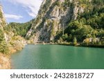 Embankment dam in the water gap of the river Enns in the Gesaeuse mountain range and view into the Enns valley. The Gesaeuse mountain range is part of the Ennstal Alps and a national park in Styria