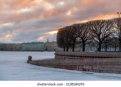 Embankment Of Neva River At Sunrise In Saint Petersburg City, Russia. Cloudy Sky. River Surface Covered With Ice. No People. Travel In Russia Theme.