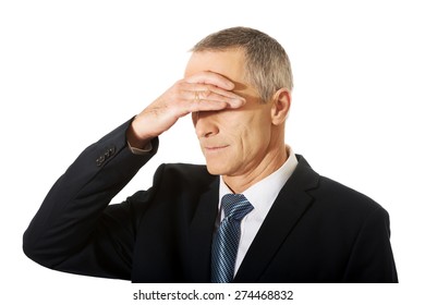 Embarassed Businessman Covering His Face.