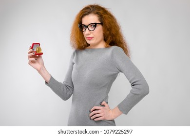 Embarassed Woman With Gift Box