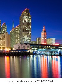 Embarcadero Towers And Ferry Building In San Francisco, Illuminated In SF 49ers Red And Gold Colors.