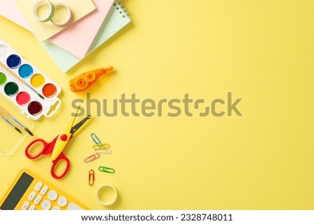 Embark on a successful educational journey with this top-down photograph of meticulously arranged school items on yellow background. Use the empty space to include text or advertisements.