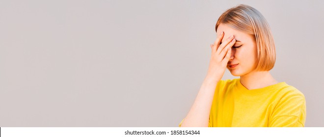 Embarrassed Annoyed Adult Woman Hiding Face Bend Head Down, Facepalm, Smirk Irritated, Not Looking Friend Acting Weird, Feel Humiliated Uncomfortable, Standing Gray Background