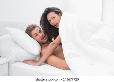 Embarrassed Couple Surprised In Bed